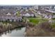 Aerial view of a neighborhood featuring a pond and townhouse-style homes at 11475 Clay Ct # 102, Fishers, IN 46037