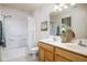 Bright bathroom featuring a double sink vanity, a shower-tub combo, and neutral color palette at 11475 Clay Ct # 102, Fishers, IN 46037