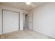 Carpeted bedroom with a ceiling fan and a double-door closet, providing comfort and storage at 11475 Clay Ct # 102, Fishers, IN 46037