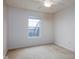 Cozy bedroom featuring natural light, carpeted floors, and a window overlooking the neighborhood at 11475 Clay Ct # 102, Fishers, IN 46037