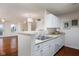 Modern eat-in kitchen featuring ample countertop space and stainless steel sink at 11475 Clay Ct # 102, Fishers, IN 46037
