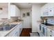Bright kitchen featuring updated appliances, ample countertop space, and a double sink at 11475 Clay Ct # 102, Fishers, IN 46037