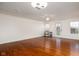 Spacious living room featuring hardwood floors and neutral wall colors, ready for personalization at 11475 Clay Ct # 102, Fishers, IN 46037