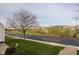 Street view of a home in a community setting with a tree in the front yard at 11475 Clay Ct # 102, Fishers, IN 46037