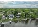 Aerial view of the home nestled among lush greenery, overlooking the serene lake at 11941 Sand Dollar Cir, Indianapolis, IN 46256