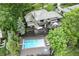 Aerial view of a beautiful home with a swimming pool, large deck, and lush landscaping at 11941 Sand Dollar Cir, Indianapolis, IN 46256