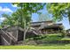 Stunning backyard featuring multi-level deck, lush landscaping, and ample space for outdoor entertaining at 11941 Sand Dollar Cir, Indianapolis, IN 46256