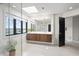 Bright bathroom featuring a double vanity, modern fixtures, and a large window with scenic views at 11941 Sand Dollar Cir, Indianapolis, IN 46256