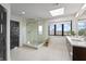 A bright bathroom with a glass-enclosed shower, a window with a view, and a modern vanity at 11941 Sand Dollar Cir, Indianapolis, IN 46256