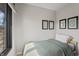 A cozy bedroom with a single bed, a window with a view, and simple decor at 11941 Sand Dollar Cir, Indianapolis, IN 46256