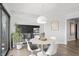 Bright dining area with modern lighting and views of the living space at 11941 Sand Dollar Cir, Indianapolis, IN 46256