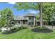 Beautiful two-story home with stone accents, lush landscaping, and a well-maintained front yard at 11941 Sand Dollar Cir, Indianapolis, IN 46256
