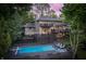 Stunning multi-level home featuring a private pool, a spacious deck, and lush landscaping, perfect for outdoor enjoyment at 11941 Sand Dollar Cir, Indianapolis, IN 46256