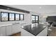 Bright kitchen featuring island, sink, stainless appliances, and access to views of the lake at 11941 Sand Dollar Cir, Indianapolis, IN 46256