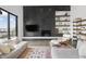 Stylish living room features a modern fireplace, built-in shelving, and comfortable seating at 11941 Sand Dollar Cir, Indianapolis, IN 46256