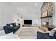 Inviting living room features a stone fireplace and comfortable seating arrangement at 11941 Sand Dollar Cir, Indianapolis, IN 46256