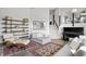 Inviting living room with modern furniture, shelving, and a decorative rug at 11941 Sand Dollar Cir, Indianapolis, IN 46256