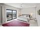 Bright main bedroom with sliding glass doors to a private balcony overlooking the water at 11941 Sand Dollar Cir, Indianapolis, IN 46256