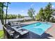 Beautiful pool with lounge chairs overlooking the lake at 11941 Sand Dollar Cir, Indianapolis, IN 46256