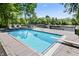 Sparkling pool surrounded by a spacious deck and lush greenery at 11941 Sand Dollar Cir, Indianapolis, IN 46256