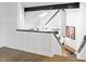 Hardwood staircase with view of skylight and lower level seating area at 11941 Sand Dollar Cir, Indianapolis, IN 46256