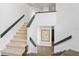 Bright staircase featuring hardwood flooring and natural light at 11941 Sand Dollar Cir, Indianapolis, IN 46256