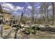 Expansive backyard features a deck, hot tub, and fire pit, providing ample space for relaxation and entertainment at 12065 Watermark Ct, Indianapolis, IN 46236