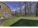 Spacious backyard with a well-maintained lawn and mature trees, offering a serene outdoor space at 12065 Watermark Ct, Indianapolis, IN 46236