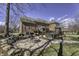 Spacious backyard featuring a brick patio, fire pit, and hot tub for outdoor relaxation at 12065 Watermark Ct, Indianapolis, IN 46236