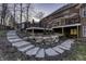 Beautifully landscaped backyard with stone steps leading to decks, creating a tranquil outdoor oasis at 12065 Watermark Ct, Indianapolis, IN 46236