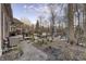 Spacious backyard featuring a deck, hot tub, and inviting fire pit area, creating the perfect outdoor retreat at 12065 Watermark Ct, Indianapolis, IN 46236