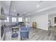 Finished basement featuring gray flooring, two chairs, game table and a barrel accent at 12065 Watermark Ct, Indianapolis, IN 46236