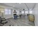 Finished basement with a fireplace, a Foosball table, a ping pong table, and plenty of windows and space at 12065 Watermark Ct, Indianapolis, IN 46236