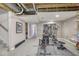 Spacious unfinished basement area with exercise equipment, promising potential for a customized living space at 12065 Watermark Ct, Indianapolis, IN 46236