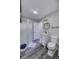 Modern bathroom features a vanity, toilet, shower, and sleek gray flooring at 12065 Watermark Ct, Indianapolis, IN 46236
