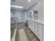 Bright bathroom with double vanity, marble countertops, and a glass-enclosed shower at 12065 Watermark Ct, Indianapolis, IN 46236