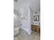 Bright bathroom with white tiled shower/tub and wooden vanity with hard surface counters at 12065 Watermark Ct, Indianapolis, IN 46236