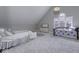Spacious bedroom featuring two beds, lots of light, vaulted ceilings, and neutral color palette at 12065 Watermark Ct, Indianapolis, IN 46236