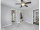 Spacious bedroom featuring carpet floors, multiple doorways, and ample closet space at 12065 Watermark Ct, Indianapolis, IN 46236