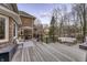 Large outdoor deck with a sofa, an umbrella, and a hot tub for ultimate relaxation at 12065 Watermark Ct, Indianapolis, IN 46236