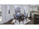 Cozy dining area featuring a large window with a view of the outside, a round table, and a dark rug at 12065 Watermark Ct, Indianapolis, IN 46236