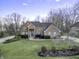 Beautiful brick home with mature landscaping and a welcoming front entrance at 12065 Watermark Ct, Indianapolis, IN 46236