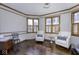 Bright home office space featuring wood floors and multiple windows at 12065 Watermark Ct, Indianapolis, IN 46236
