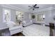 Open-concept living room with hardwood floors, neutral tones, and ample natural light at 12065 Watermark Ct, Indianapolis, IN 46236
