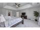 Large main bedroom with tray ceiling, dresser, and plush carpeting at 12065 Watermark Ct, Indianapolis, IN 46236