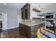 Wet bar features granite countertops, custom cabinets, wine rack, and mosaic backsplash at 12065 Watermark Ct, Indianapolis, IN 46236