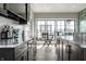 Bright bar area with granite countertops, ample cabinetry, and direct access to the outdoor patio at 12099 Sigillary Way, Carmel, IN 46032