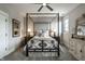 Elegant bedroom featuring a four-poster bed with luxury bedding and classic decorative touches at 12099 Sigillary Way, Carmel, IN 46032