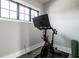 Home exercise area featuring a stationary bike and yoga mat for convenient fitness routines at 12099 Sigillary Way, Carmel, IN 46032
