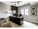 Well-appointed home office with a spacious desk, comfortable seating, and ample storage at 12099 Sigillary Way, Carmel, IN 46032